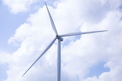 Low angle view of windmill against sky