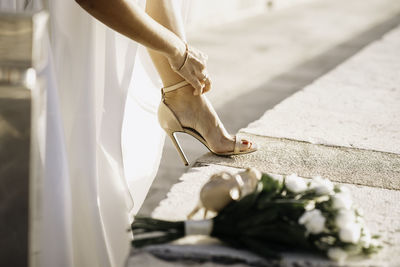 Low section of woman standing on floor
