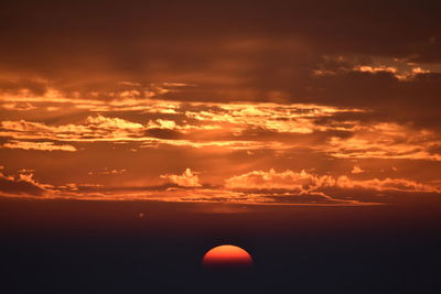 Scenic view of dramatic sky during sunset