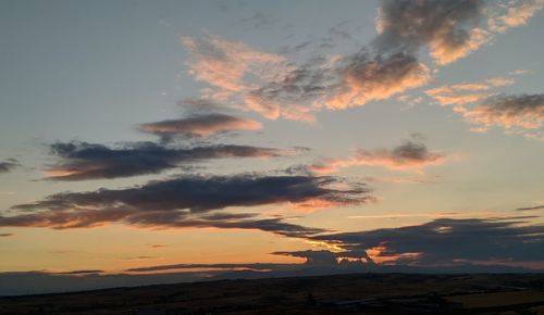 Low angle view of dramatic sky during sunset