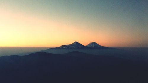 Scenic view of mountains at sunset