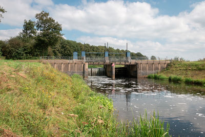 Bridge over river against sky