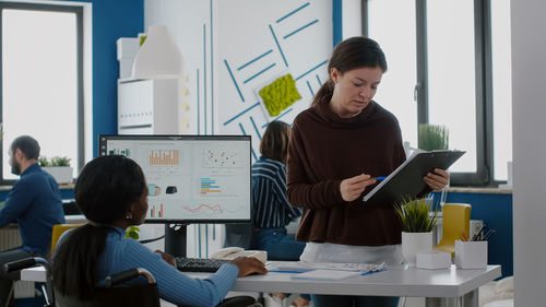 Colleagues working at office