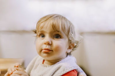 Portrait of cute baby girl at home