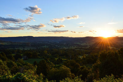 Scenic view of landscape against sky during sunset