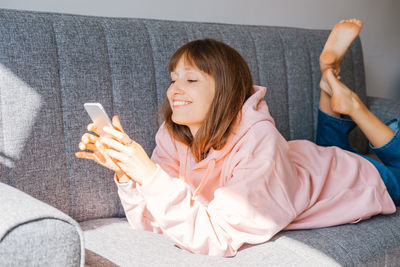 Young woman using mobile phone