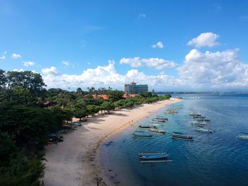 Scenic view of beach against blue sky