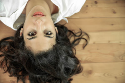 Dog lying on tiled floor