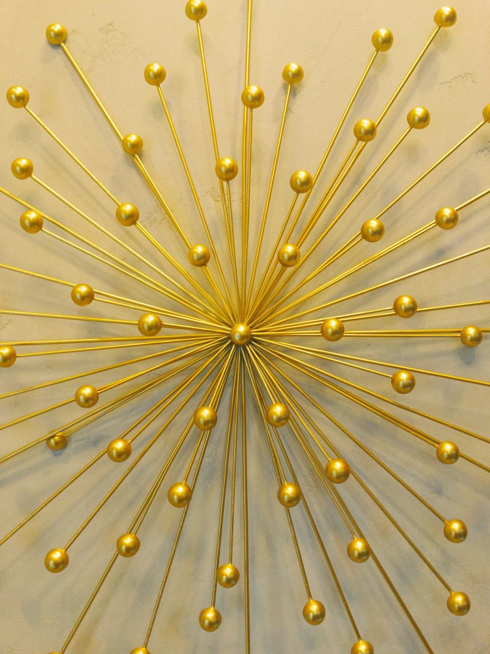 gold colored, no people, backgrounds, yellow, indoors, full frame, pattern, studio shot, large group of objects, repetition, abundance, close-up, decoration, gold, connection, in a row, luxury, design, illuminated, side by side