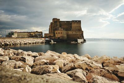 Scenic view of sea against cloudy sky