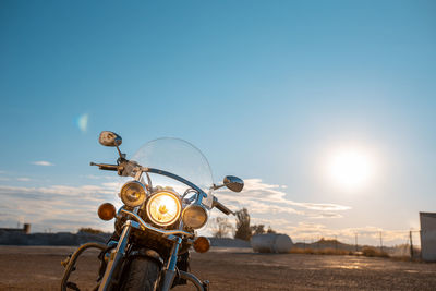 Motorcycle on road against sky