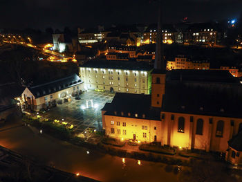 High angle view of illuminated buildings at night