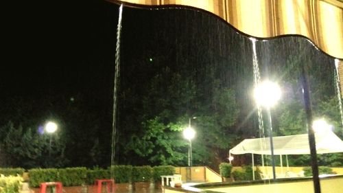 Low angle view of illuminated street light at night