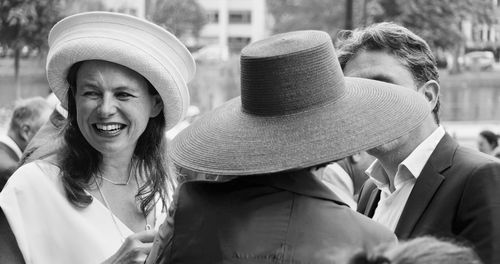 Portrait of happy friends with hat