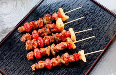 High angle view of meat on barbecue