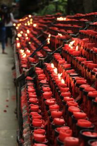 View of illuminated candles in temple