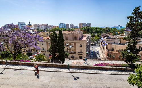 View of buildings in city against clear sky