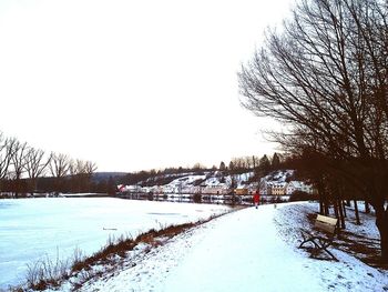 Scenic view of lake against clear sky during winter