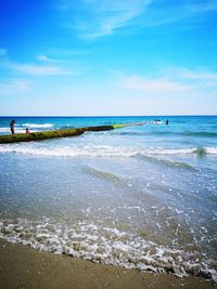 Scenic view of beach against sky