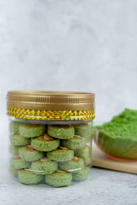 Biskut mazola kacang hijau is a green peas cookies with background decoration