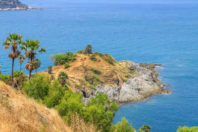 High angle view of rocks by sea