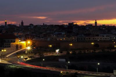 High angle view of illuminated city buildings at night