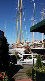 Boats moored at harbor