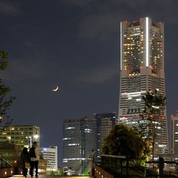 Illuminated buildings in city at night