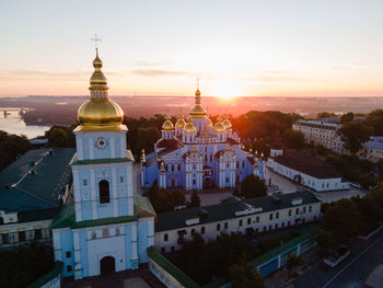 High angle view of buildings against sky at sunset