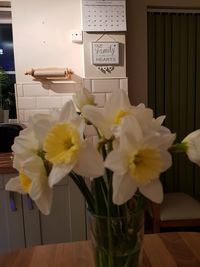 Close-up of white flowers in vase on table