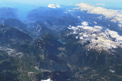 Aerial view of snowcapped mountains against sky