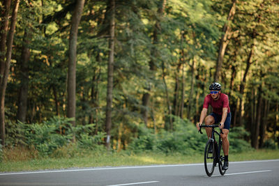 Man riding bicycle on road