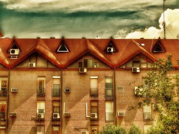 Houses against sky in city