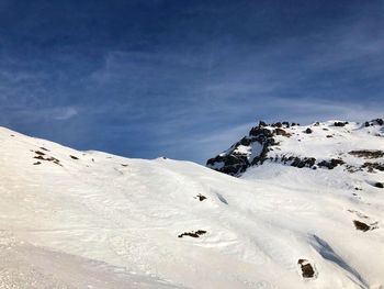 Snow covered mountain against sky