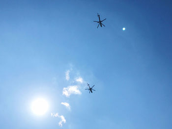 Low angle view of airplane flying in sky