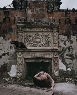 Full length of woman on abandoned building