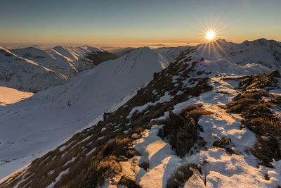 Scenic view of snowcapped mountains against sky during sunset, fagaras mountains