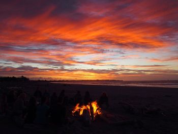 Scenic view of beach against sky during sunset