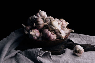 Close-up of vegetables on table against black background