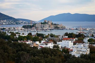 High angle view of townscape by sea