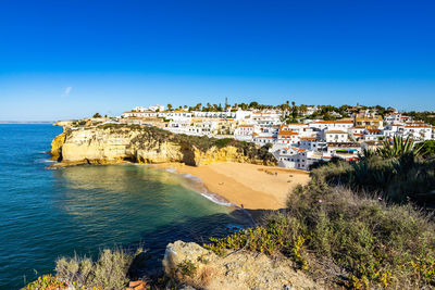 View of carvoeiro, a pretty holiday village with a beautiful sandy beach, algarve, portugal