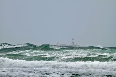 Scenic view of sea against clear sky