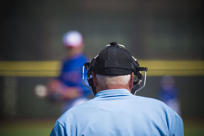 Rear view of referee on baseball field