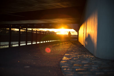 Illuminated bridge against sky during sunset