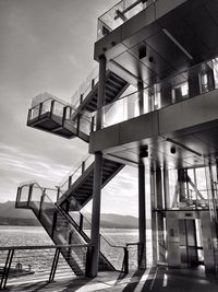 Building by sea against sky