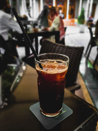 Close-up of coffee in glass on table