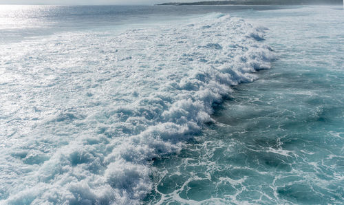 Scenic view of sea against blue sky