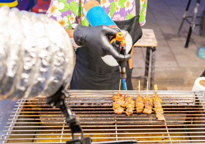Beef steaks on the grill with flames in street food.
