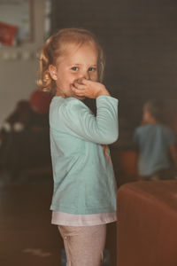 Portrait of girl standing on floor