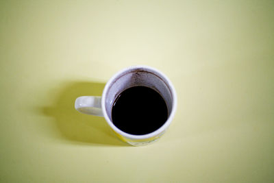 High angle view of black coffee on table